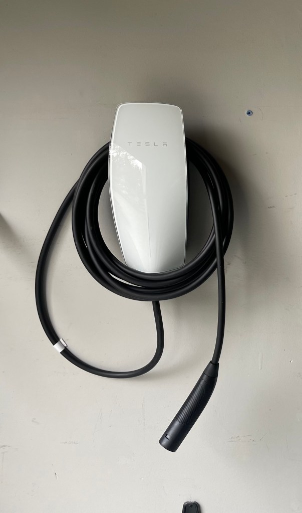 Tesla EV Charger for 48 amps service.  Clean look. Wiring inside the wall. Installed by Scott at West Seattle Electrician.